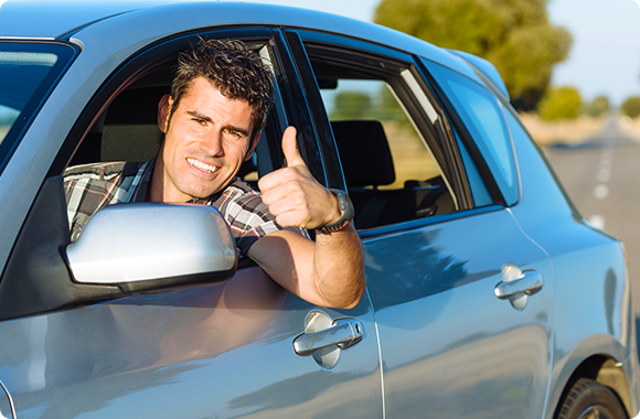 man with thumbs up because he has Automobile Insurance in La Quinta, Cathedral City, Thousand Palms, Indio, Coachella, Palm Springs