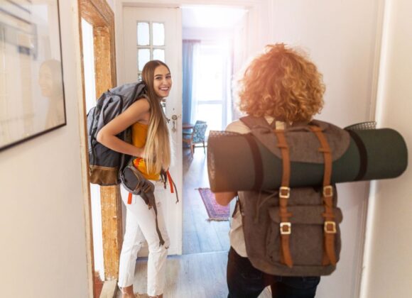Two Young Girls Arriving at Airbnb with Airbnb Short-Term Rental Coverage